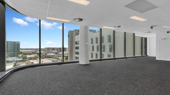 An image showcasing one of the tenancies inside of 50 First Avenue, with floor to ceiling windows showing views across Maroochydore.