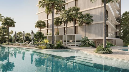An artist’s impression of the residents’ pool area at SOL by Walker. A large pool lined by lounge chairs and gardens fills the majority of the area, with some smaller spa pools at the edge of the space.