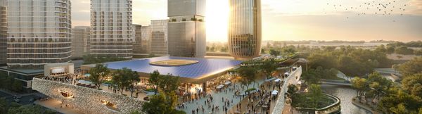 An artist’s impression of a large public event space between towers of Maroochydore City Centre at dusk. Many people are spread across the surrounding terrace and within the event space.