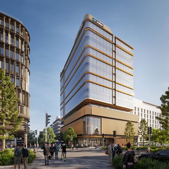 An artist’s impression of the exterior of 50 First Avenue seen from across an intersection. The glass-walled ground floor lobby sits below several wood-panelled floors leading to multiple floors of gleaming glass-walled offices reflecting the sun.